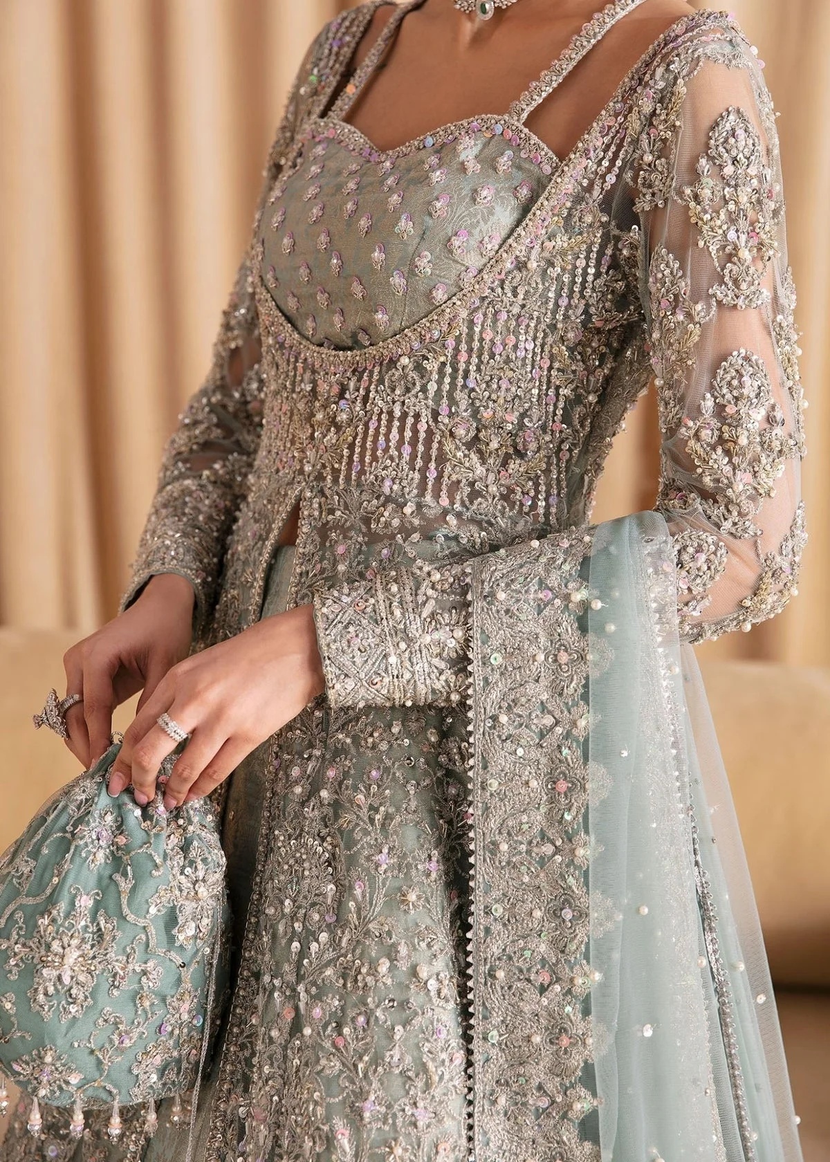 RIJA I KANWAL MALIK clothing in blue tones.